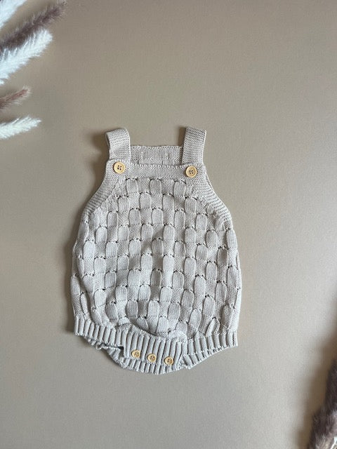 Knitted romper with buttons