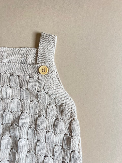 Knitted romper with buttons