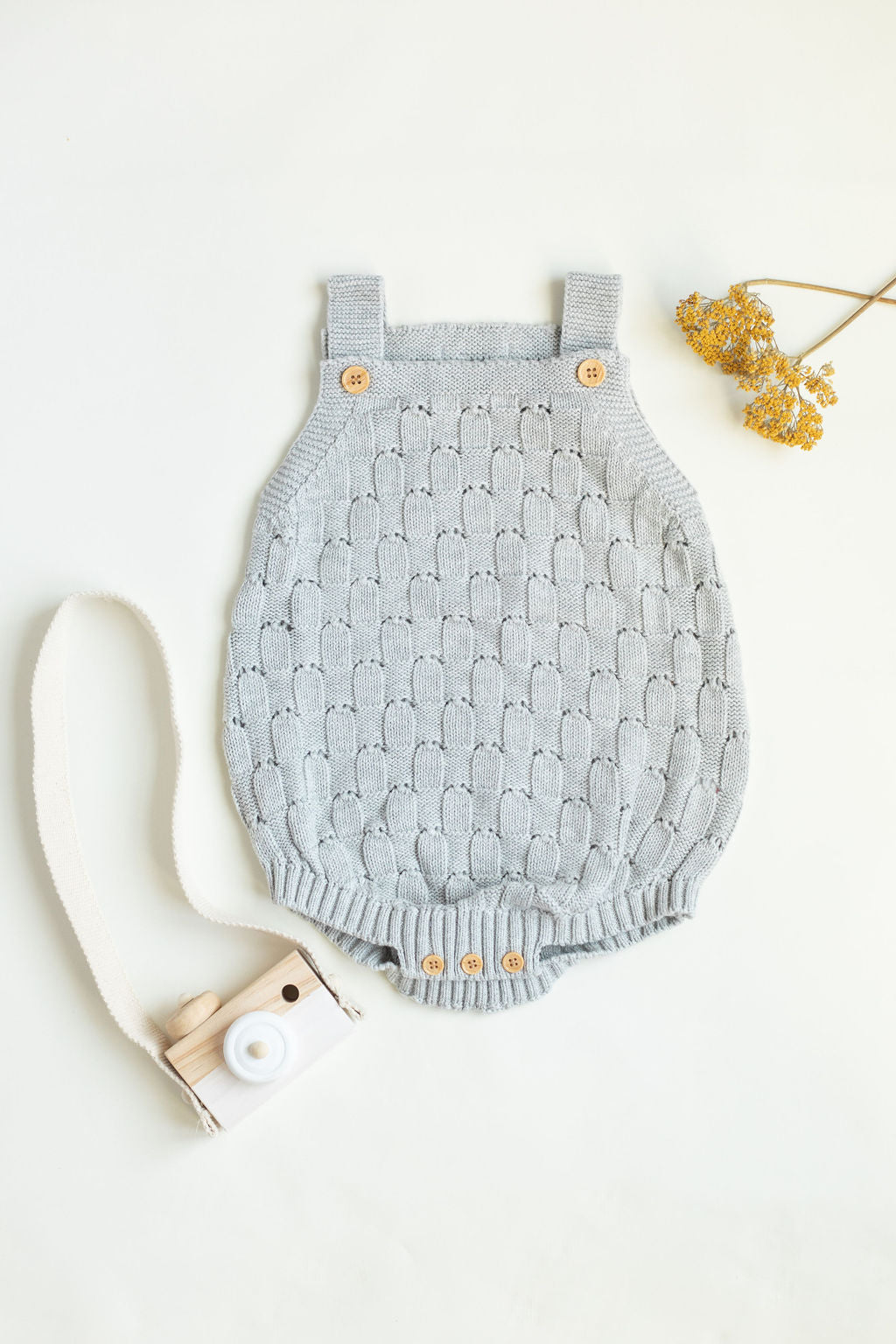 Knitted romper with buttons