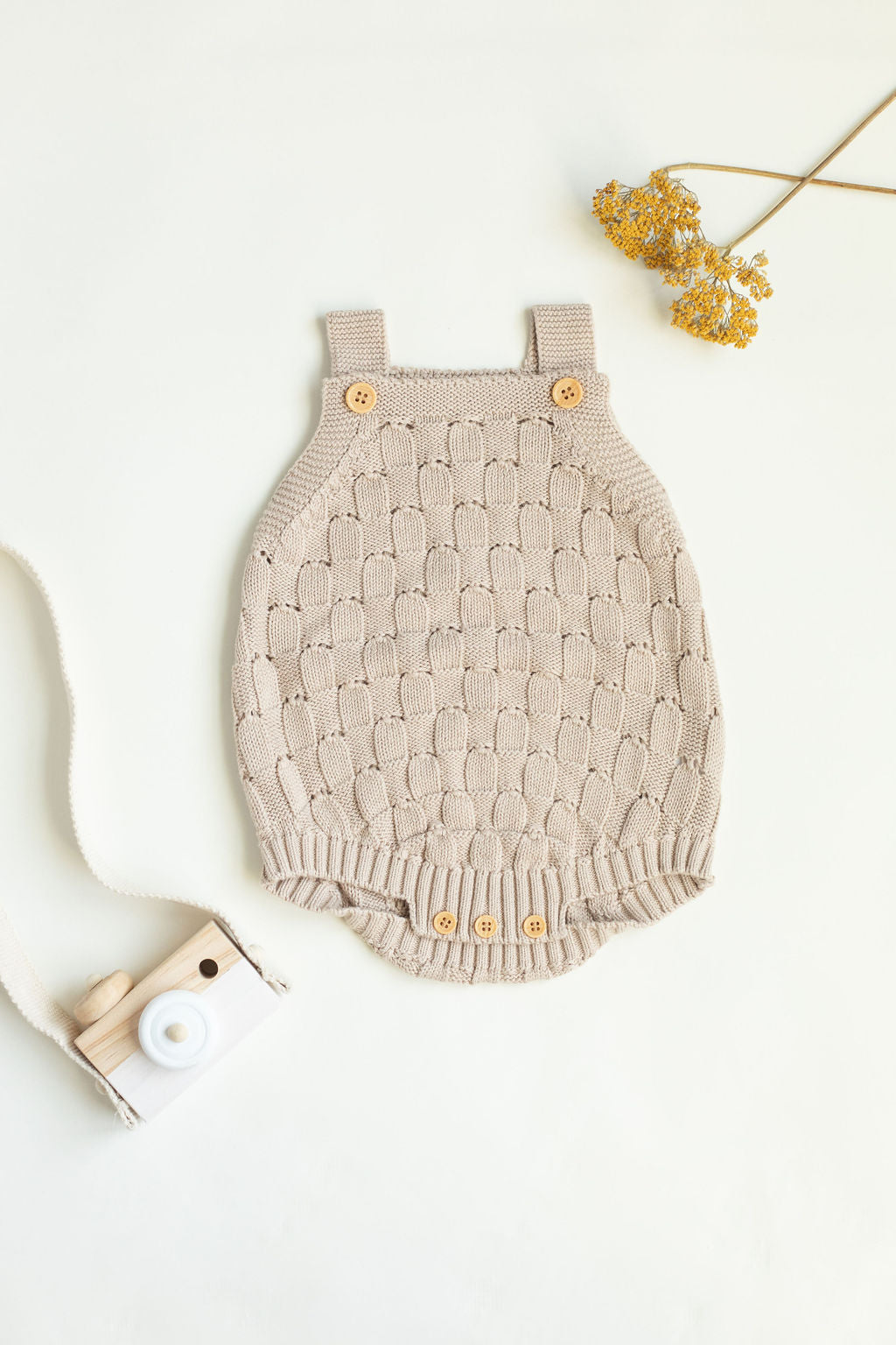 Knitted romper with buttons